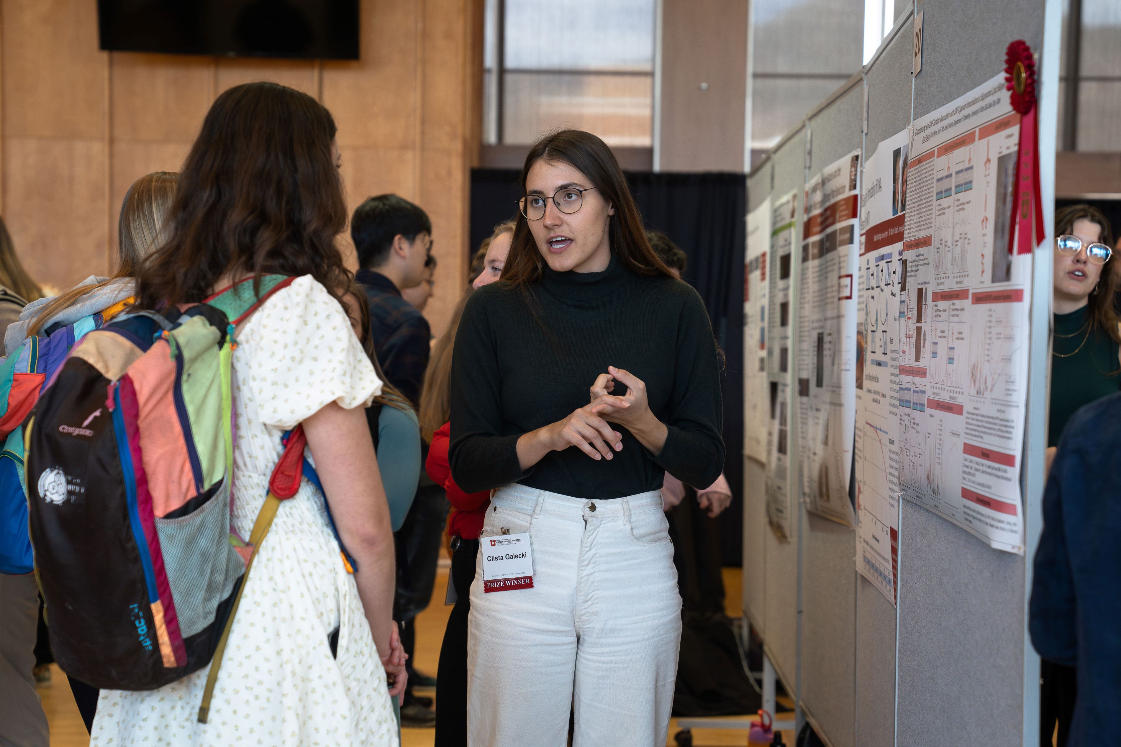 Clista presents her research at the OUR Symposium, winning a best-poster award!